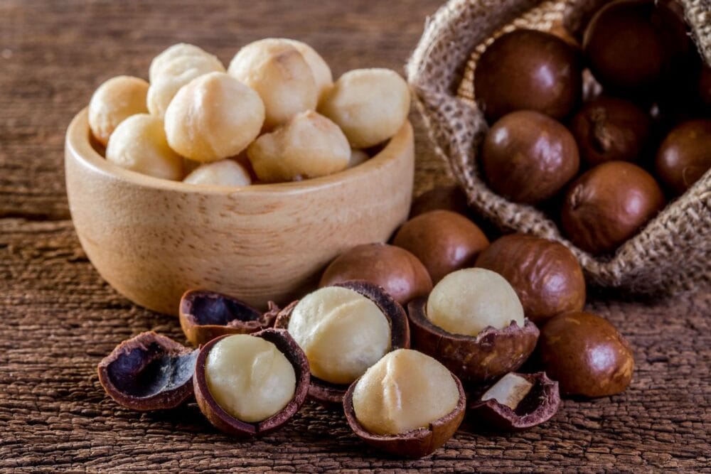 macadamia nuts on wooden table