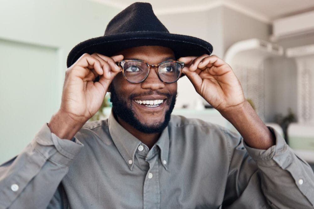 man wearing a hat in someones home