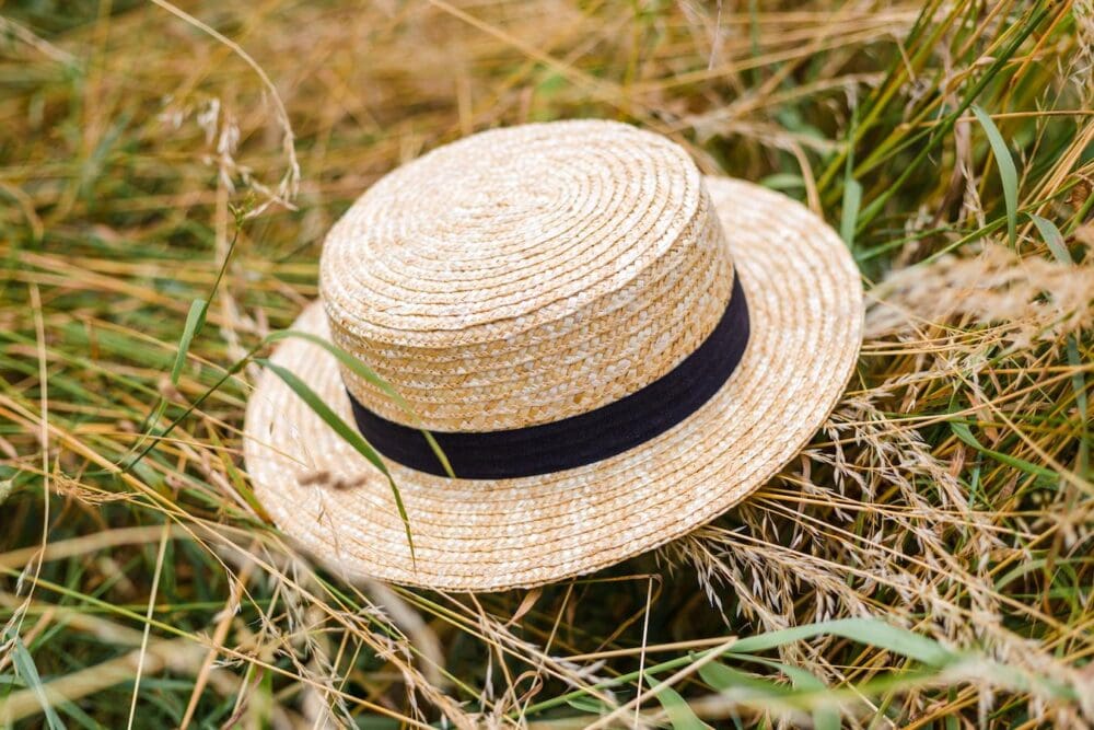 straw boater hat in the grass