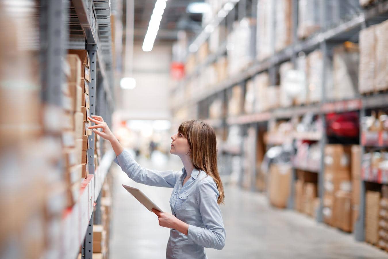 woman in warehouse wholesale real estate real estate market product category